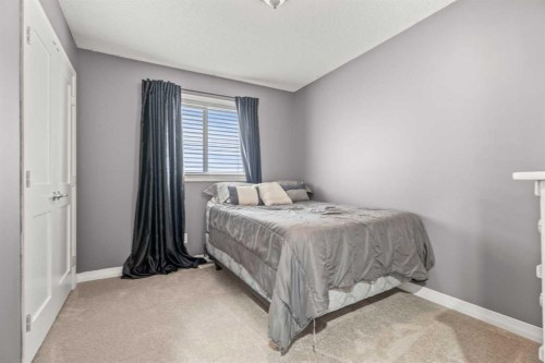 715 Copperpond Circle Se, Calgary, AB - Indoor Photo Showing Bedroom