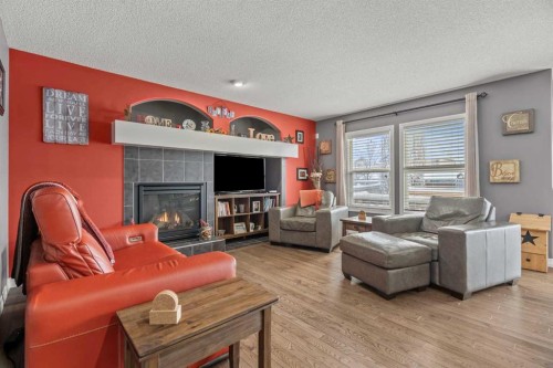 715 Copperpond Circle Se, Calgary, AB - Indoor Photo Showing Living Room With Fireplace