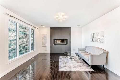 1396 Shawnee Road Sw, Calgary, AB - Indoor Photo Showing Living Room With Fireplace
