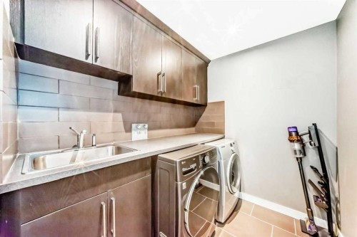 1396 Shawnee Road Sw, Calgary, AB - Indoor Photo Showing Laundry Room