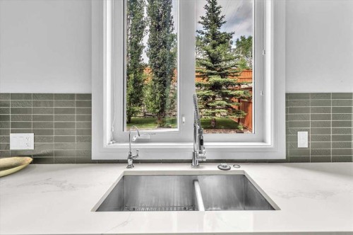 151 Aspen Vista Way Sw, Calgary, AB - Indoor Photo Showing Kitchen With Double Sink