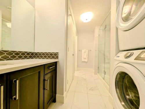 151 Aspen Vista Way Sw, Calgary, AB - Indoor Photo Showing Laundry Room