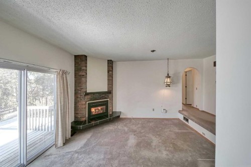 616 Dalmeny Hill Nw, Calgary, AB - Indoor With Fireplace