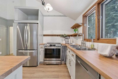 3 Redwood Meadows Close, Rural Rocky View County, AB - Indoor Photo Showing Kitchen With Double Sink