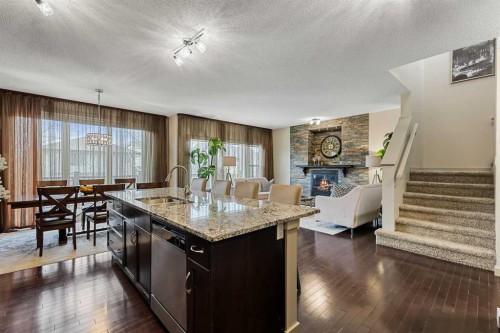 20 Walden View Se, Calgary, AB - Indoor Photo Showing Other Room With Fireplace