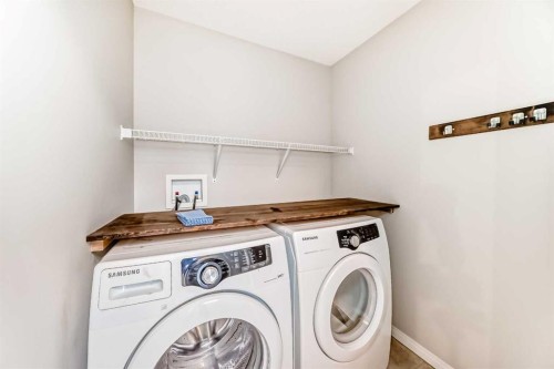 16 Fireside Way, Cochrane, AB - Indoor Photo Showing Laundry Room