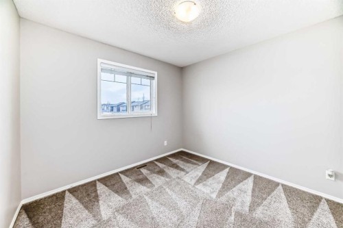 16 Fireside Way, Cochrane, AB - Indoor Photo Showing Other Room