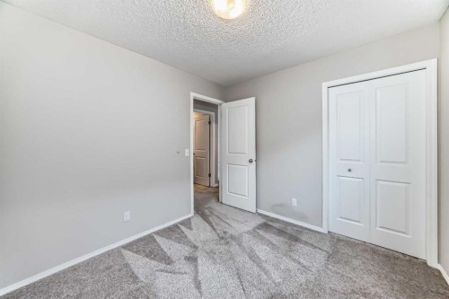 16 Fireside Way, Cochrane, AB - Indoor Photo Showing Other Room