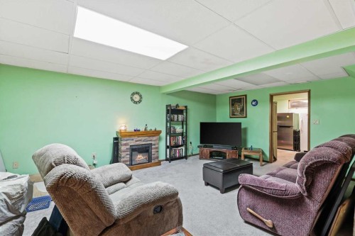 115 Castlegreen Close Ne, Calgary, AB - Indoor Photo Showing Living Room With Fireplace