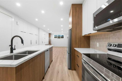 3519 42 Street Sw, Calgary, AB - Indoor Photo Showing Kitchen With Double Sink With Upgraded Kitchen