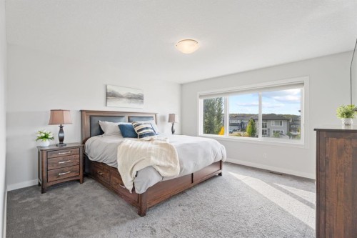 39 Cranbrook Green Se, Calgary, AB - Indoor Photo Showing Bedroom