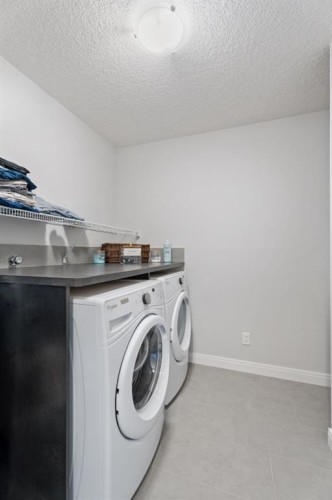 39 Cranbrook Green Se, Calgary, AB - Indoor Photo Showing Laundry Room