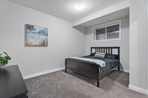 39 Cranbrook Green Se, Calgary, AB - Indoor Photo Showing Bedroom