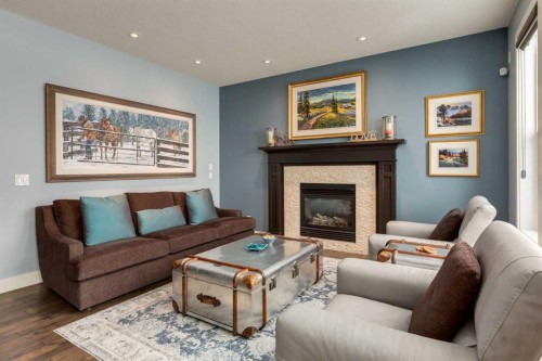 308 Rainbow Falls Way, Chestermere, AB - Indoor Photo Showing Living Room With Fireplace