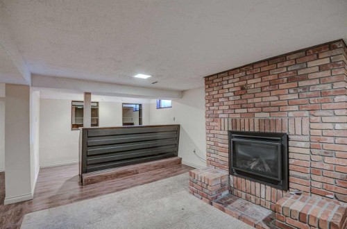 3420 Lane Crescent Sw, Calgary, AB - Indoor Photo Showing Living Room With Fireplace