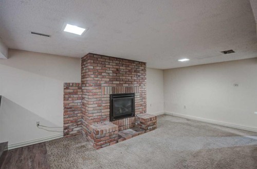 3420 Lane Crescent Sw, Calgary, AB - Indoor With Fireplace