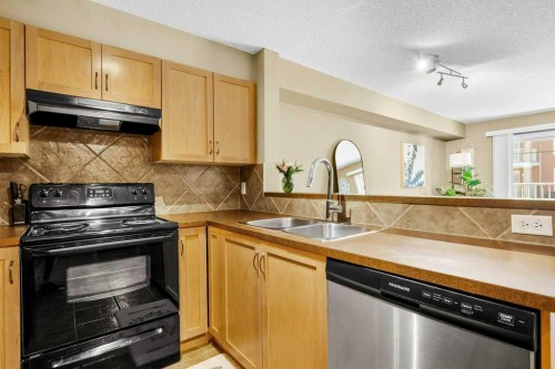 8107-70 Panamount Drive Nw, Calgary, AB - Indoor Photo Showing Kitchen With Double Sink
