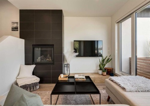 4905 16 Street Sw, Calgary, AB - Indoor Photo Showing Living Room With Fireplace