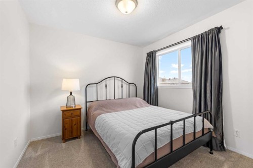 62 Canoe Circle Sw, Airdrie, AB - Indoor Photo Showing Bedroom