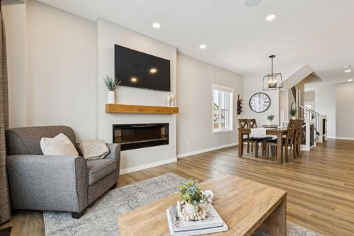103 Saddlebred Link, Cochrane, AB - Indoor Photo Showing Living Room With Fireplace