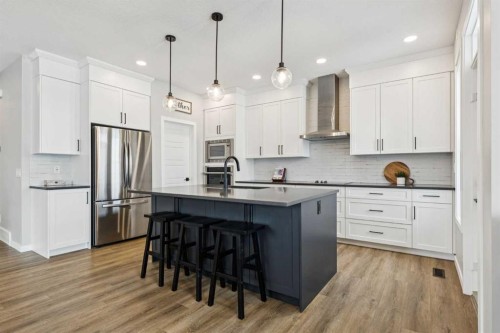103 Saddlebred Link, Cochrane, AB - Indoor Photo Showing Kitchen With Stainless Steel Kitchen With Upgraded Kitchen