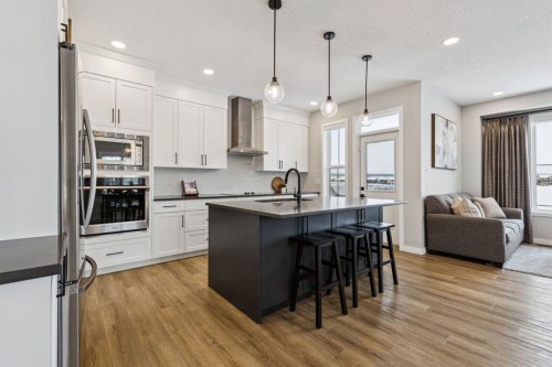 103 Saddlebred Link, Cochrane, AB - Indoor Photo Showing Kitchen With Stainless Steel Kitchen With Upgraded Kitchen