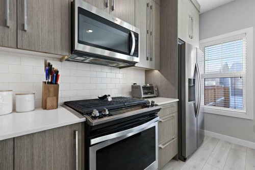 1249 Carrington Boulevard Nw, Calgary, AB - Indoor Photo Showing Kitchen With Upgraded Kitchen