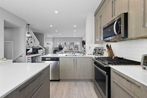 1249 Carrington Boulevard Nw, Calgary, AB - Indoor Photo Showing Kitchen With Stainless Steel Kitchen With Double Sink