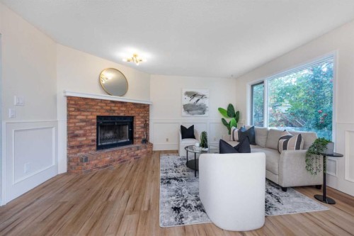 47 Hawkstone Drive Nw, Calgary, AB - Indoor Photo Showing Living Room With Fireplace