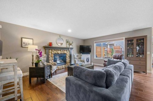 178 Cranwell Close Se, Calgary, AB - Indoor Photo Showing Living Room With Fireplace