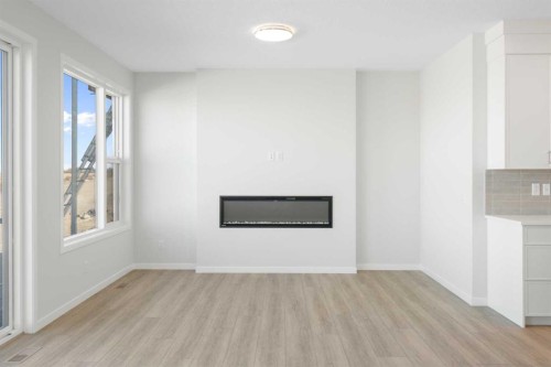 136 Lucas Gardens Nw, Calgary, AB - Indoor Photo Showing Living Room With Fireplace