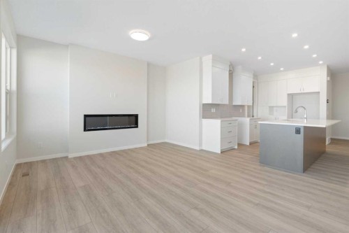 136 Lucas Gardens Nw, Calgary, AB - Indoor Photo Showing Kitchen With Fireplace