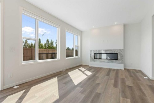 266 West Grove Lane Sw, Calgary, AB - Indoor Photo Showing Living Room With Fireplace
