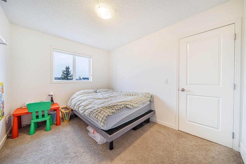 30 Chapalina Park Crescent Se, Calgary, AB - Indoor Photo Showing Bedroom
