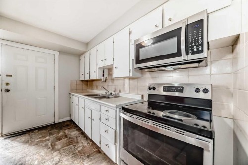 2223 36 Street Se, Calgary, AB - Indoor Photo Showing Kitchen With Double Sink