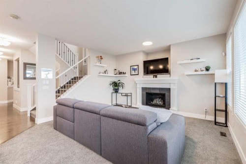 80 Evansfield Place Nw, Calgary, AB - Indoor Photo Showing Living Room With Fireplace