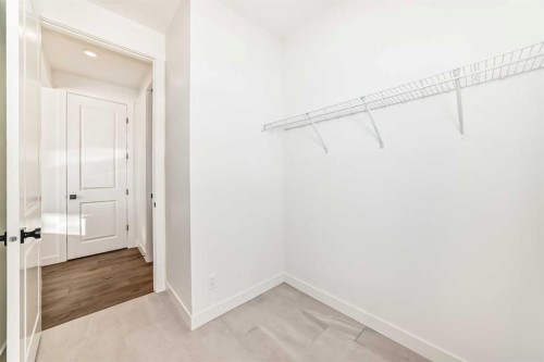 191 Perch Bend, Rural Rocky View County, AB - Indoor With Storage