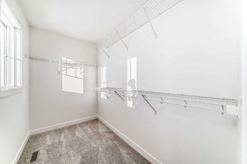 191 Perch Bend, Rural Rocky View County, AB - Indoor With Storage