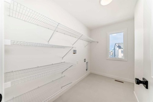 191 Perch Bend, Rural Rocky View County, AB - Indoor With Storage