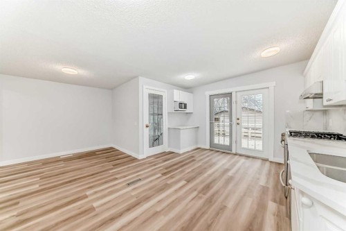 307 Huntridge Road Ne, Calgary, AB - Indoor Photo Showing Kitchen With Double Sink