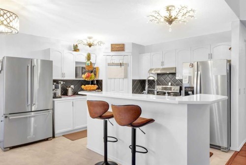 60 Tuscarora Way Nw, Calgary, AB - Indoor Photo Showing Kitchen With Upgraded Kitchen