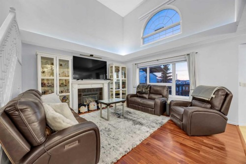60 Tuscarora Way Nw, Calgary, AB - Indoor Photo Showing Living Room With Fireplace