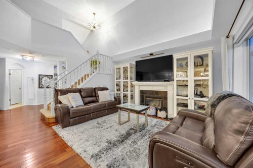 60 Tuscarora Way Nw, Calgary, AB - Indoor Photo Showing Living Room With Fireplace