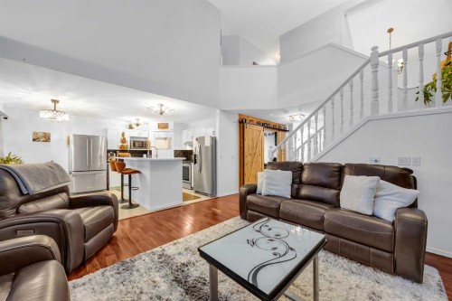 60 Tuscarora Way Nw, Calgary, AB - Indoor Photo Showing Living Room