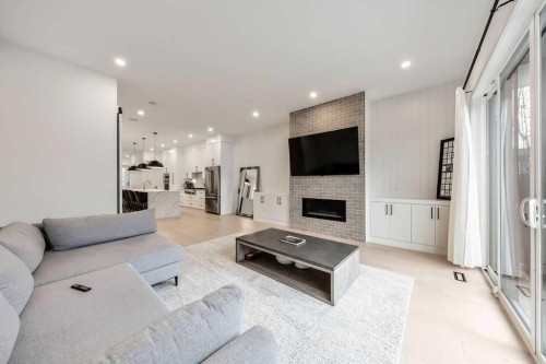2024 50 Avenue Sw, Calgary, AB - Indoor Photo Showing Living Room With Fireplace