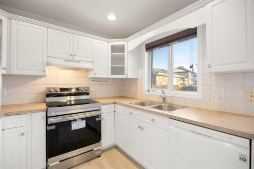 13 Coville Gardens Ne, Calgary, AB - Indoor Photo Showing Kitchen With Double Sink