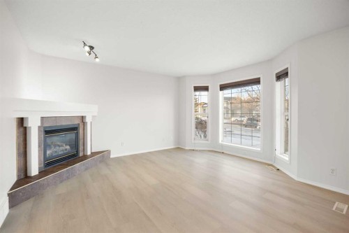 13 Coville Gardens Ne, Calgary, AB - Indoor Photo Showing Living Room With Fireplace
