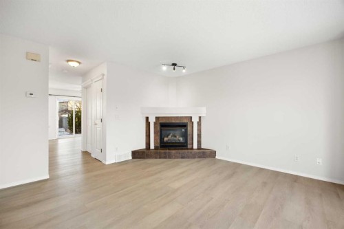 13 Coville Gardens Ne, Calgary, AB - Indoor Photo Showing Living Room With Fireplace