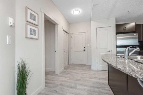 2305-5605 Henwood Street Sw, Calgary, AB - Indoor Photo Showing Kitchen With Double Sink