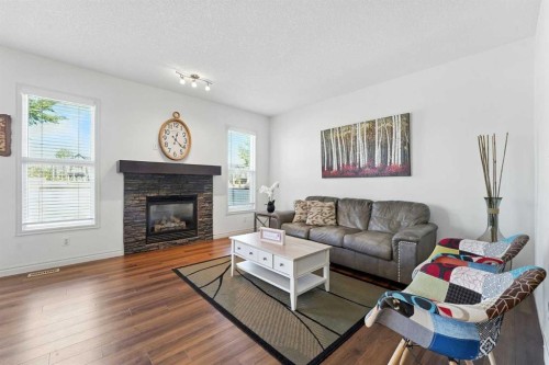 57 Evansglen Mews Nw, Calgary, AB - Indoor Photo Showing Living Room With Fireplace